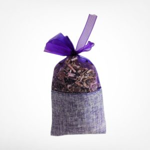 Purple burlap and gauze sachet bag filled with dried herbs and tied with a purple guaze ribbon